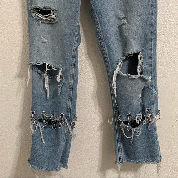 Jeans are cropped at the ankle and wide in the waist. - Picture 4 of 9